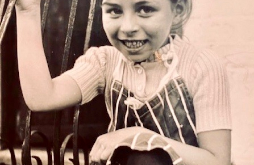 A young Lia gets ready to help in the kitchen.