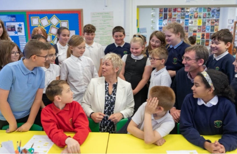 Lia Nici MP (Centre) surrounded by pupils