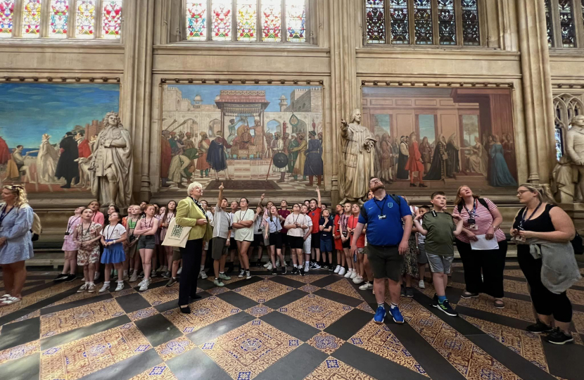 Wybers students point at the Great Grimsby crest